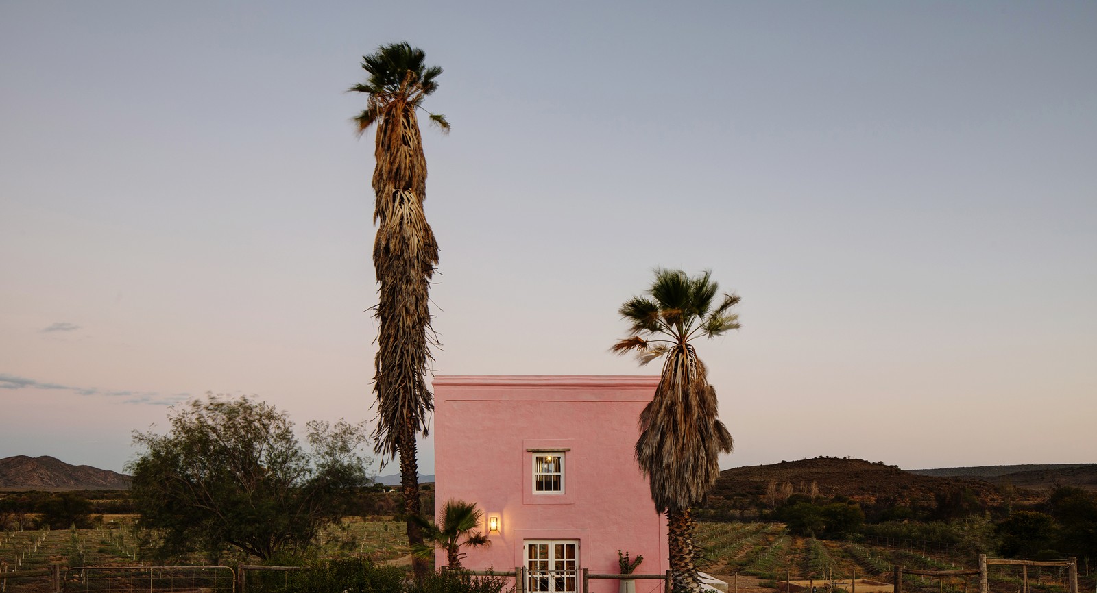 Buffelsdrift pink building — completed, at dusk